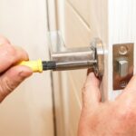 locksmith at work fixing a lock