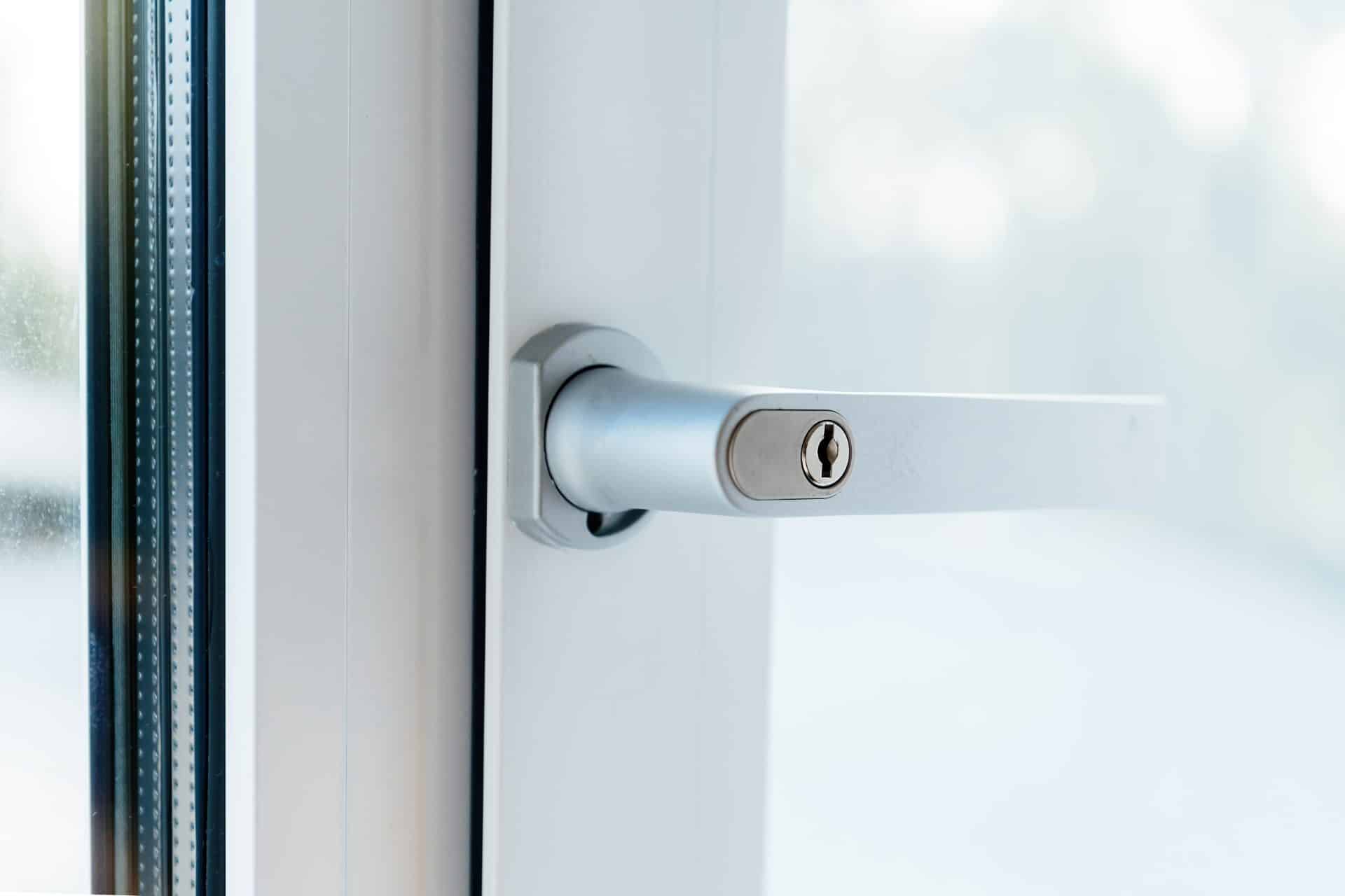 window-lock-1 Close-up view of a sleek window lock integrated into a modern insulated window, ensuring enhanced protection and energy efficiency for homes.